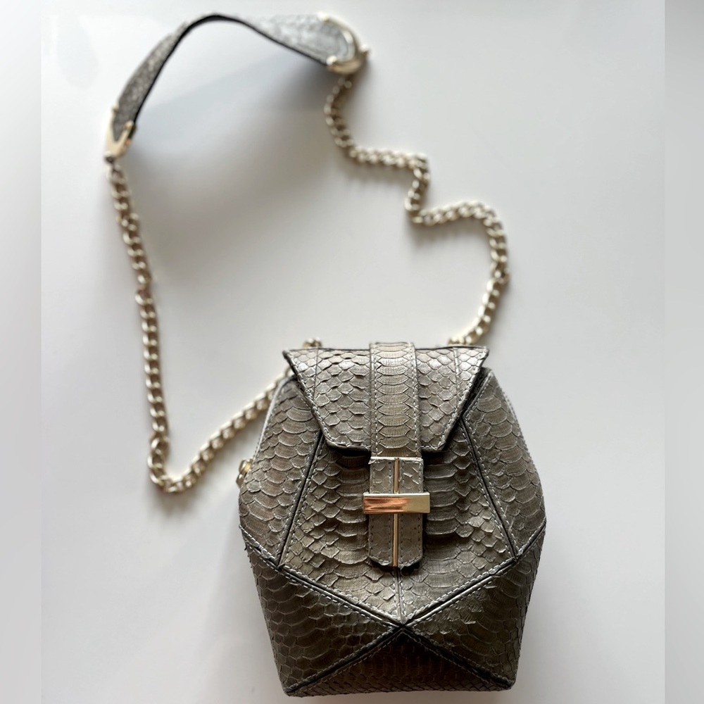 Angel Jackson taupe, leather bag with gold chain.